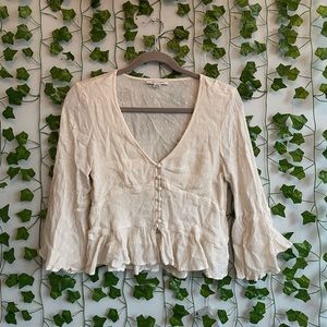 Cream colored American eagle button up, flowy blouse in a size medium